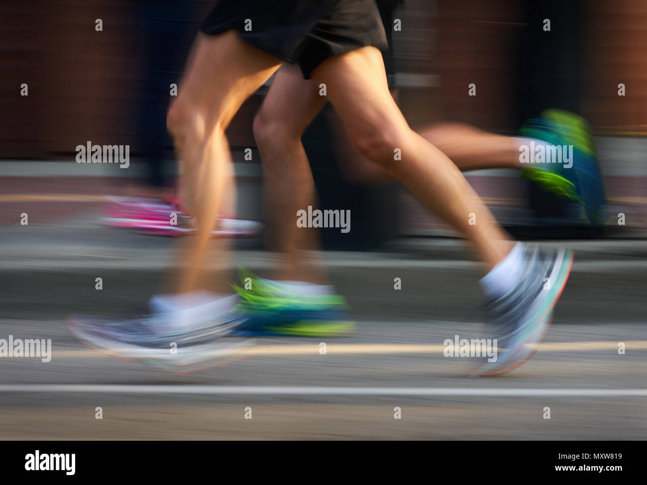 Runners in an Urban Running Race Competitors in a running race. Motion