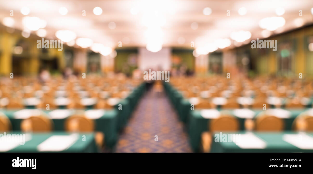Blurred, defocused background of modern conference room or university lecture hall. Company business meeting, convention center, education concept Stock Photo