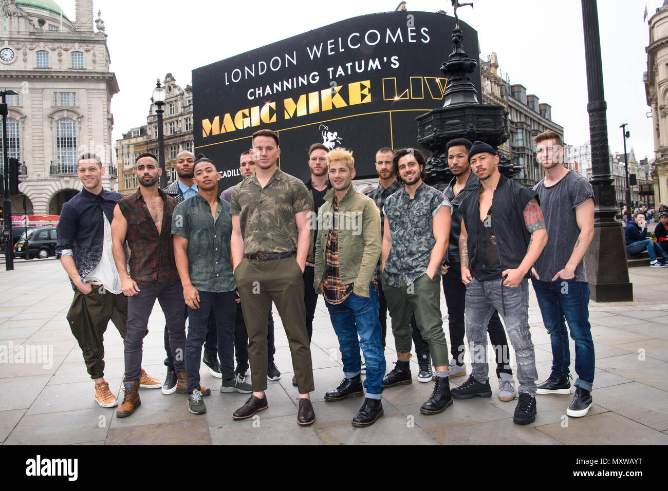 Channing Tatum pictured with dancers from Magic Mike Live in Piccadilly Circus, London, as the giant screens welcome the show to the capital. Stock Photo