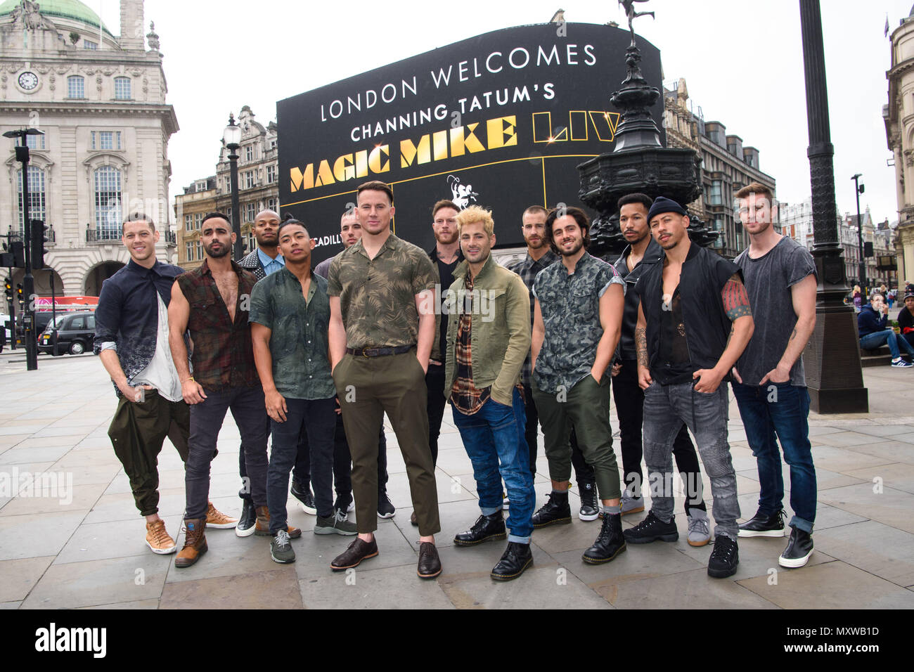 Channing Tatum pictured with dancers from Magic Mike Live in Piccadilly Circus, London, as the giant screens welcome the show to the capital. Stock Photo
