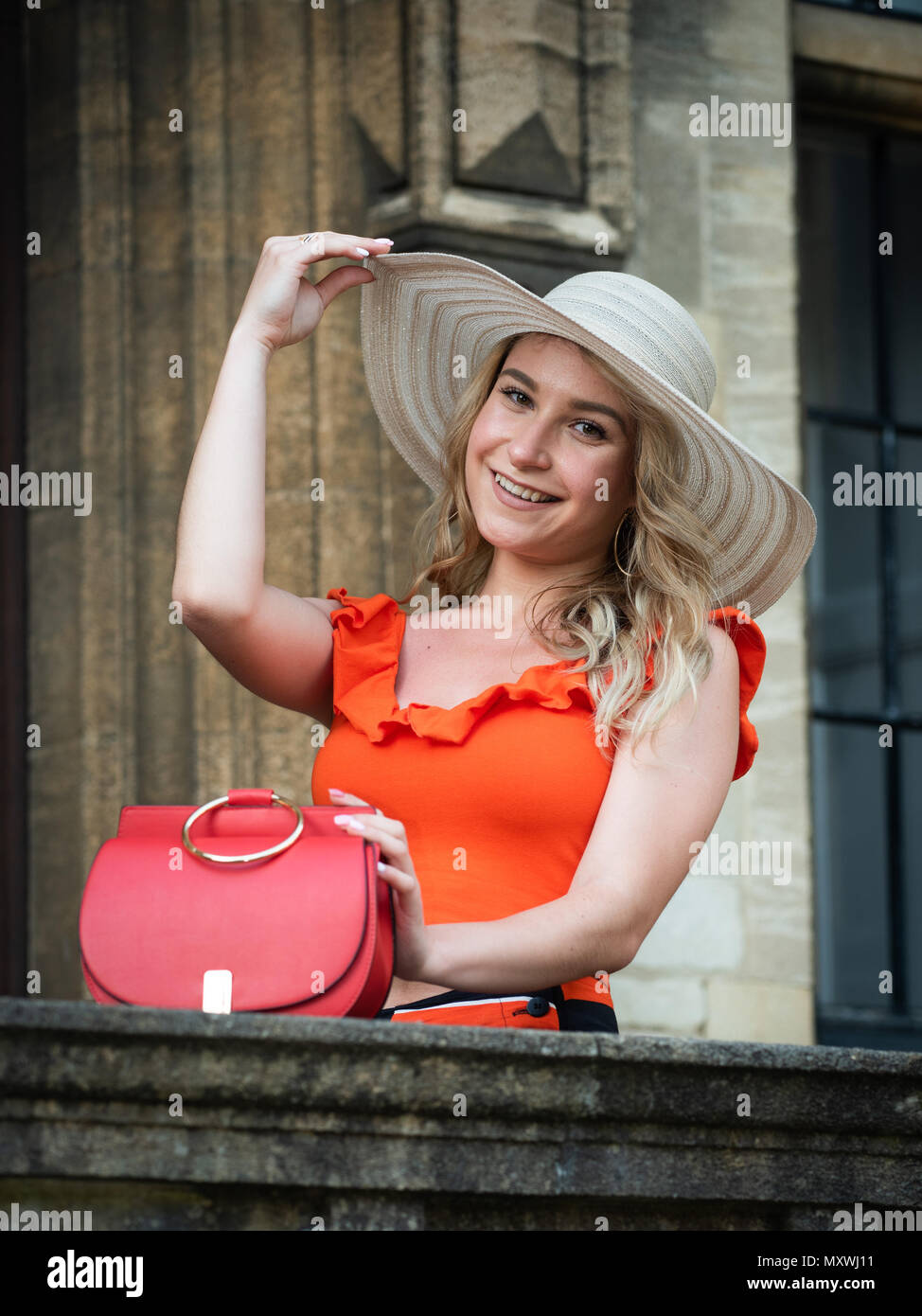 Fashion and lifestyle blogger Andreea Rasclescu posing for pictures at Trinity College, Oxford University, Oxford,UK Stock Photo