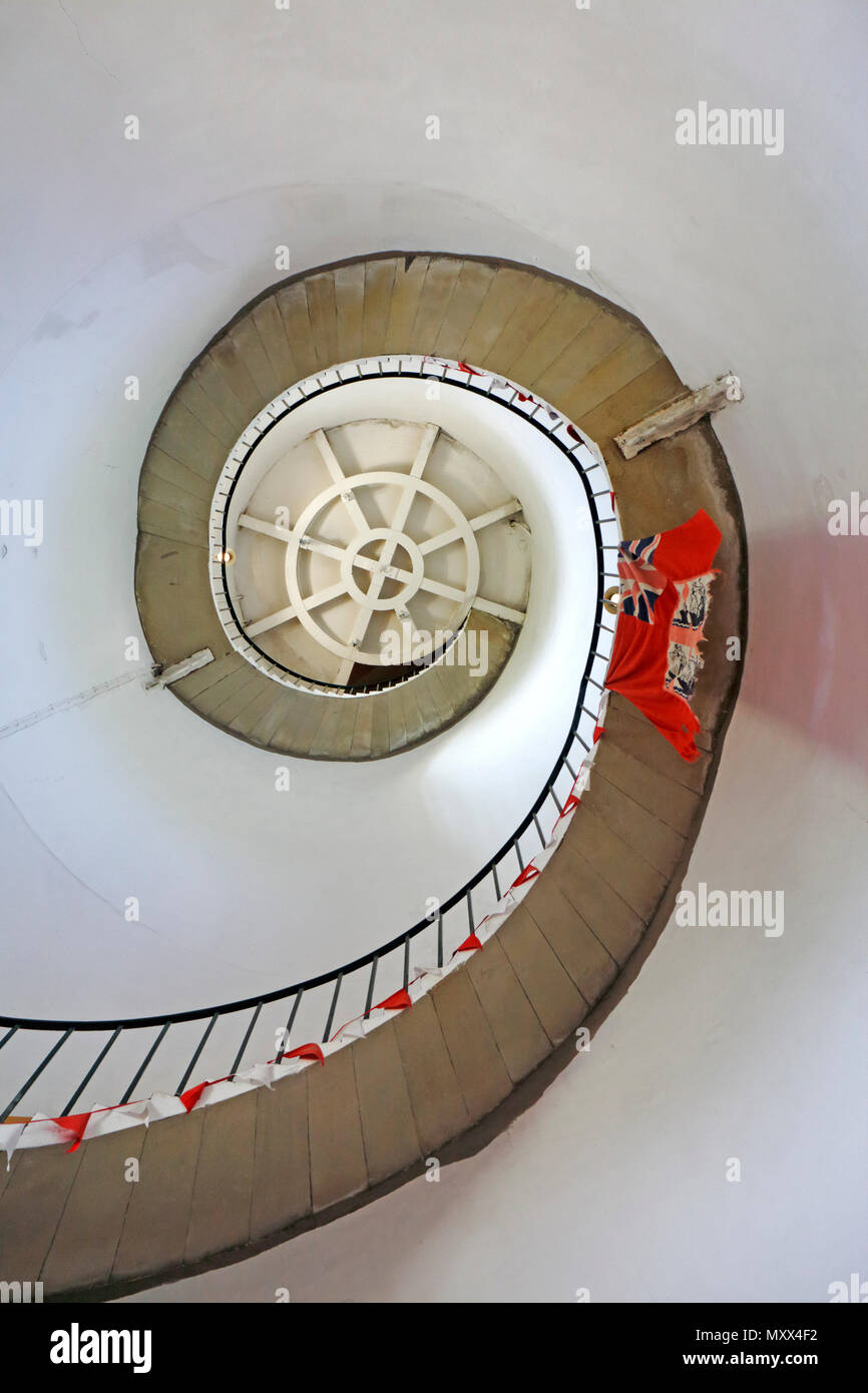 A view of the steps to the service room in the interior of Happisburgh Lighthouse on the Norfolk coast at Happisburgh, Norfolk, England, UK, Europe. Stock Photo