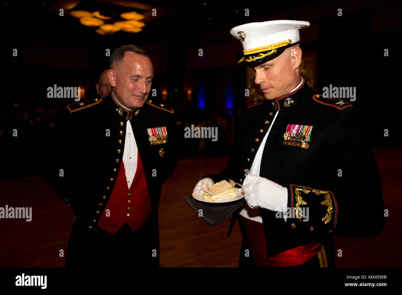 U.S. Marine Corps Col. Mark M. Tull, right, chief of staff of Marine Corps Recruit Depot San Diego and the Western Recruiting Region, takes a bite of cake during a ceremony at the Hilton San Diego Bayfront hotel, San Diego, Calif., Nov. 12, 2016.  Tull was given a piece of cake as the oldest active duty Marine during the 241st Marine Corps birthday celebration. (U.S. Marine Corps photo by Lance Cpl. Robert G. Gavaldon) Stock Photo