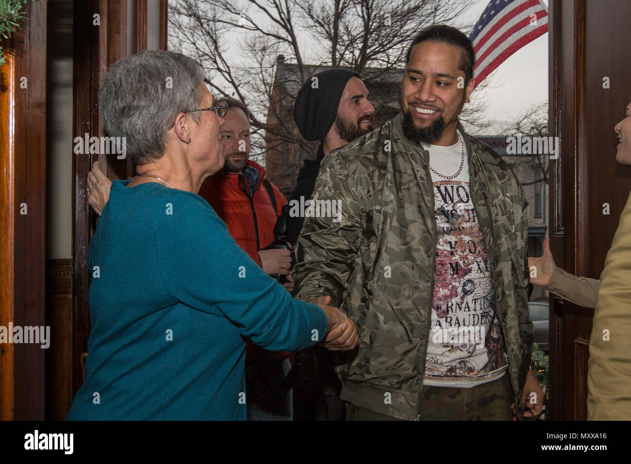 D’Arcy Neller, wife of Commandant of the Marine Corps Gen. Robert B. Neller, left,  shakes hands with Jey Uso, WWE wrestler, at the Home of the Commandants, Washington, D.C., Dec. 13, 2016. Uso and other Superstars were invited to meet with the Commandant, tour Marine Barracks Washington, and eat lunch with Marines. (U.S. Marine Corps photo by Cpl. Samantha K. Braun) Stock Photo