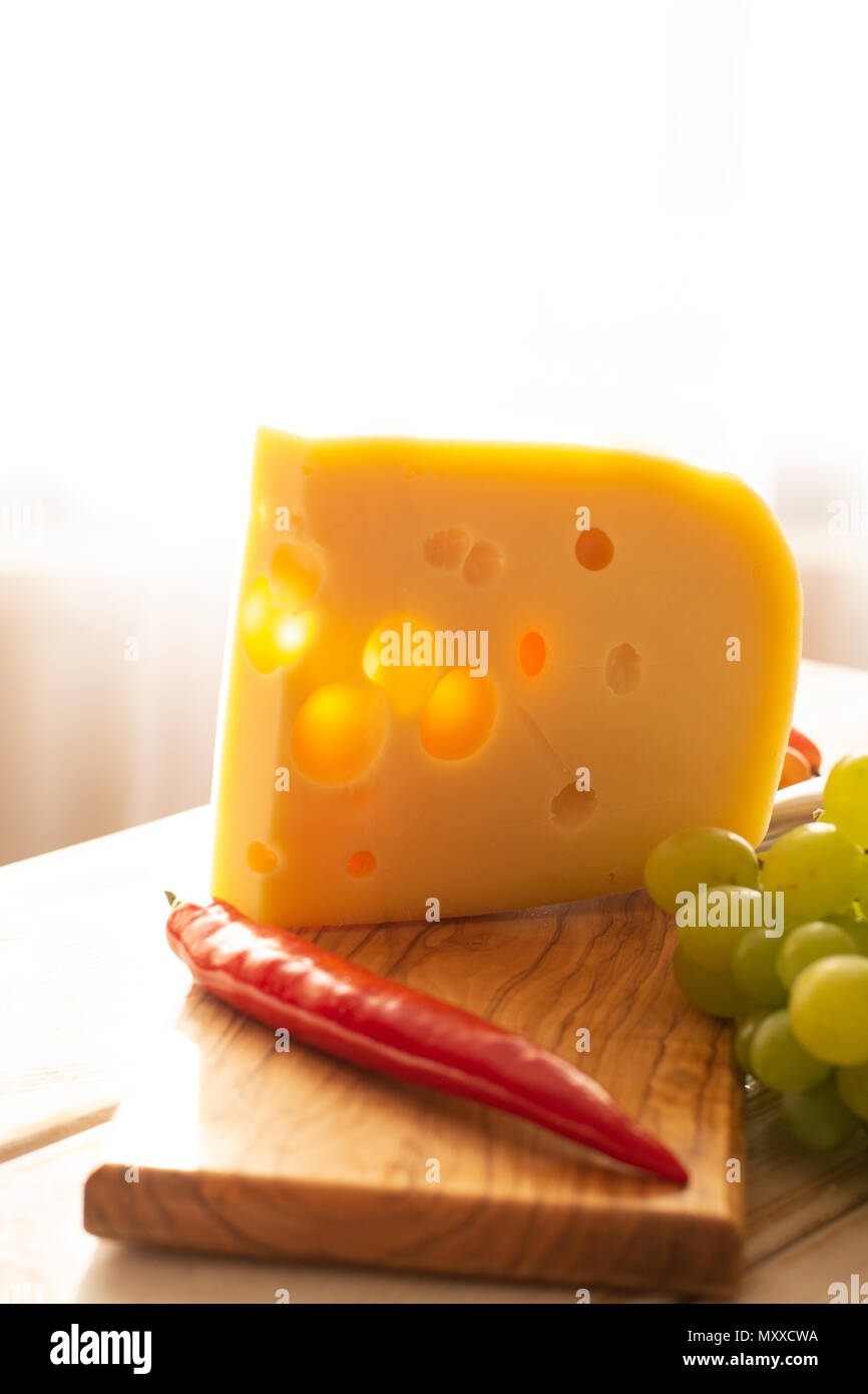 Dutch hard cheese Maasdam or Emmentaler, cheese with holes Stock Photo