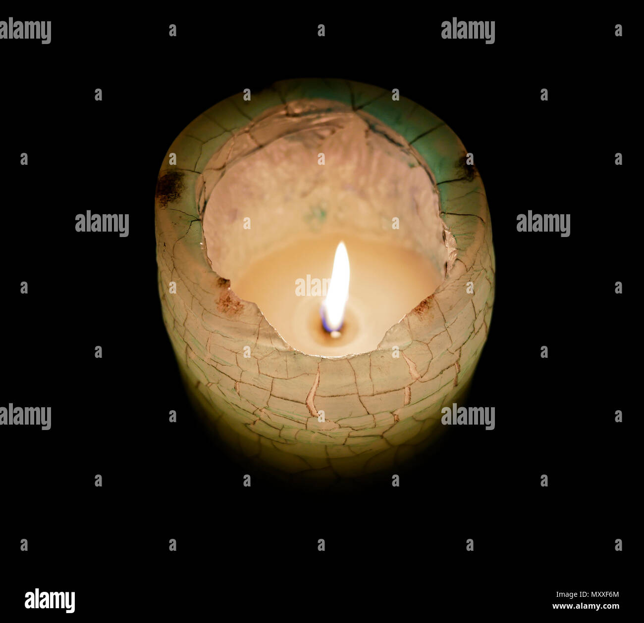 Beautiful blue and green candle with bright and vibrant orange and