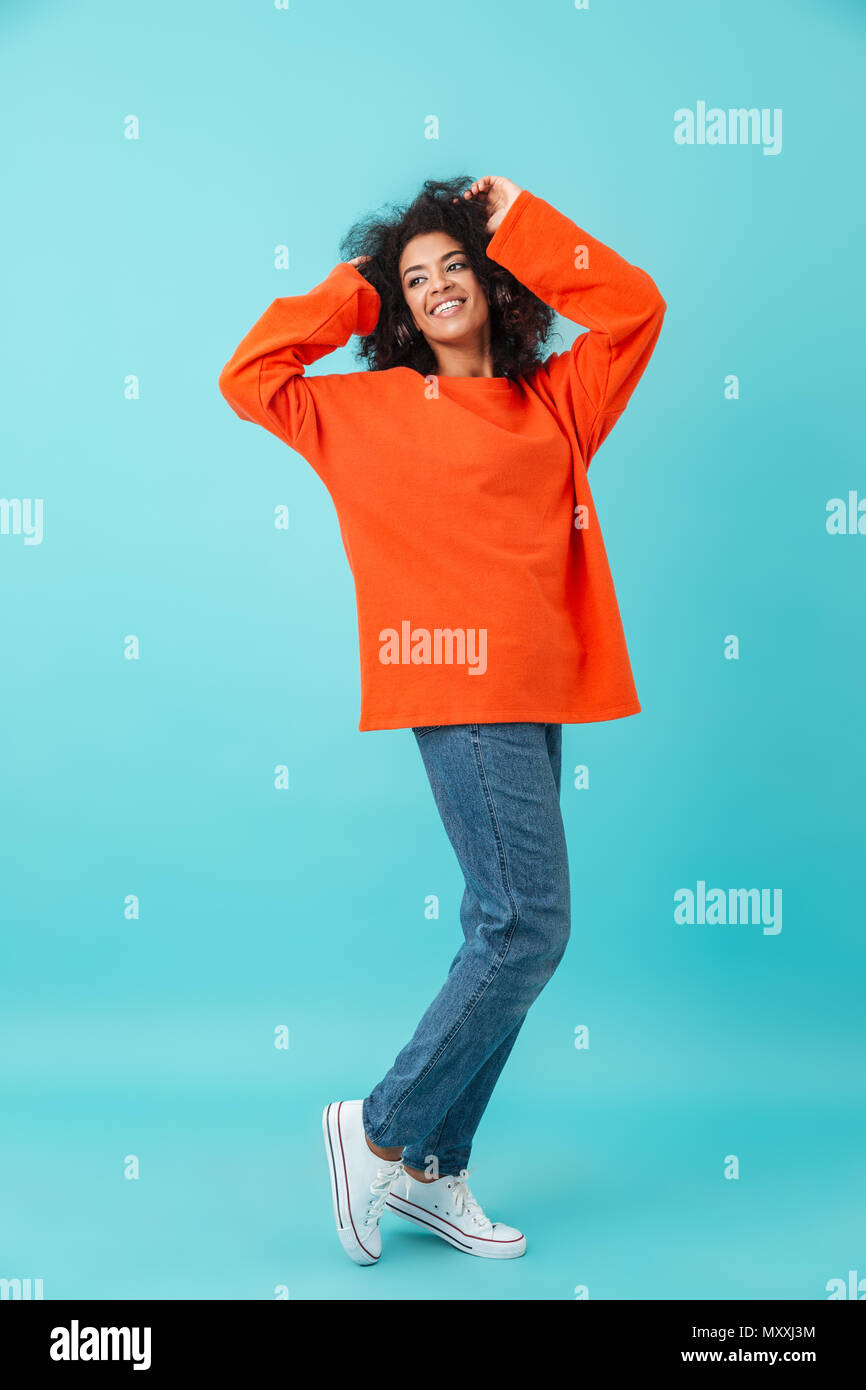 Woman with orange shirt hi-res stock photography and images - Alamy