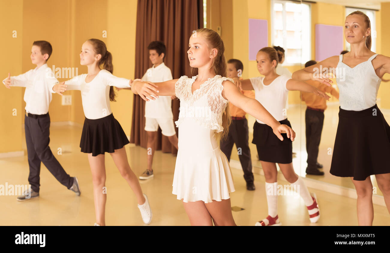 positive children learn dance movements in dance class Stock Photo Alamy