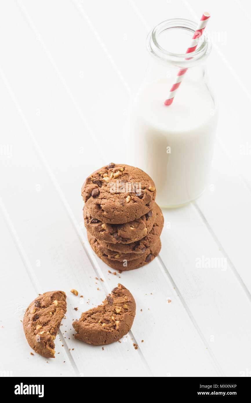 Tasty chocolate cookies and milk on white table Stock Photo Alamy