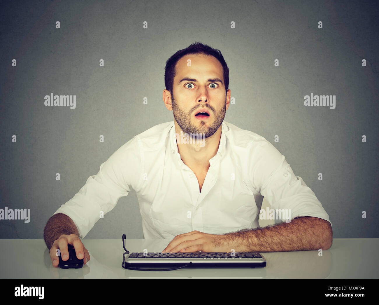 Confused face and computer hi-res stock photography and images - Alamy
