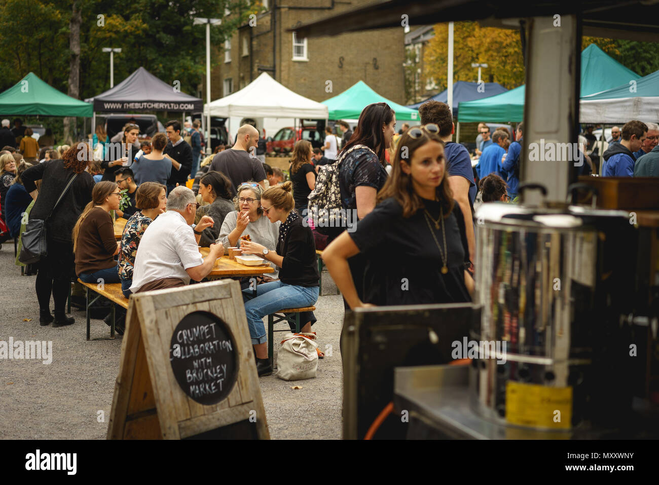 London, UK - October 2017. People shopping at Brockley Market, a local farmer's market held every Saturday in Lewisham. Landscape format. Stock Photo
