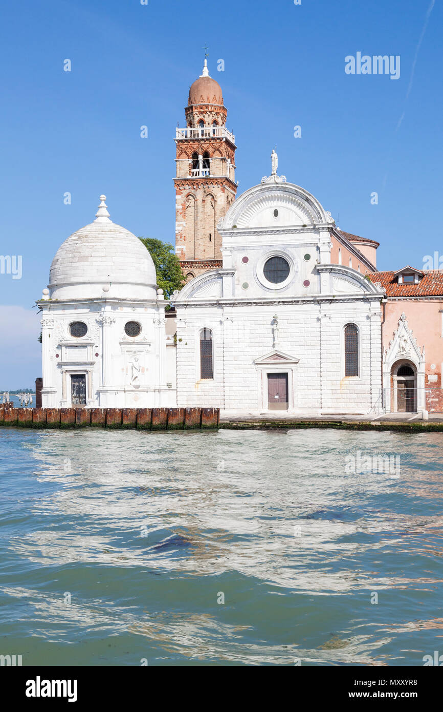 The Renaissance facade and bell tower of Chiesa di San Michele in Isola, San Michele Island, Venice, Veneto, Italy. Built 1469. Cemetery island. Monas Stock Photo