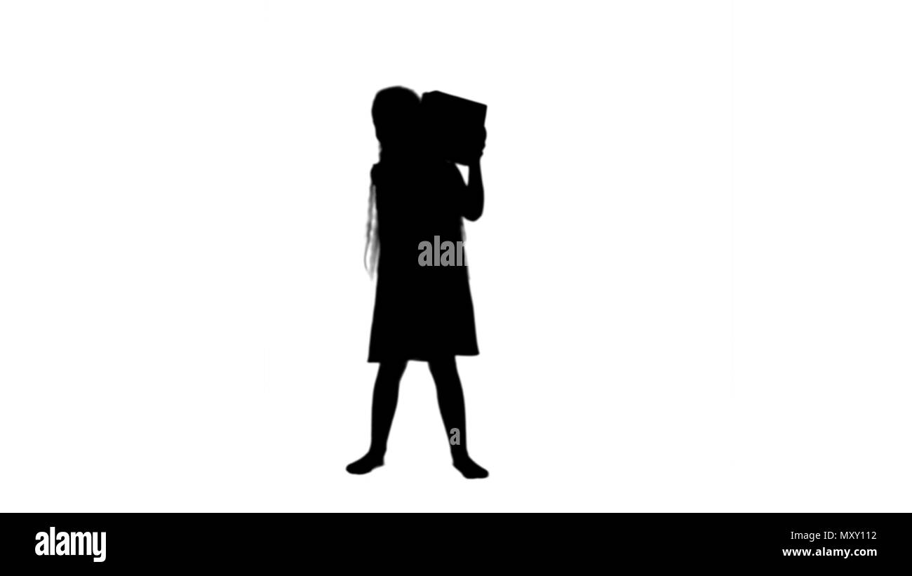 Silhouette Joyful little girl holding box present in hands track matte  Stock Photo - Alamy