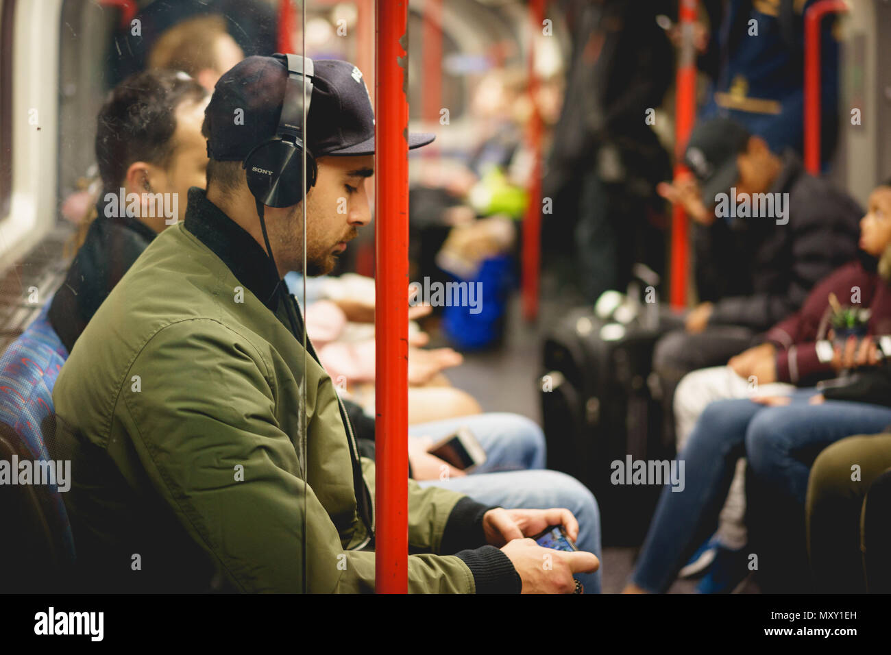 London, UK - October 2017. People commuting on an underground train in London. The Tube handles up to 5 Million passenger per day. Landscape format. Stock Photo