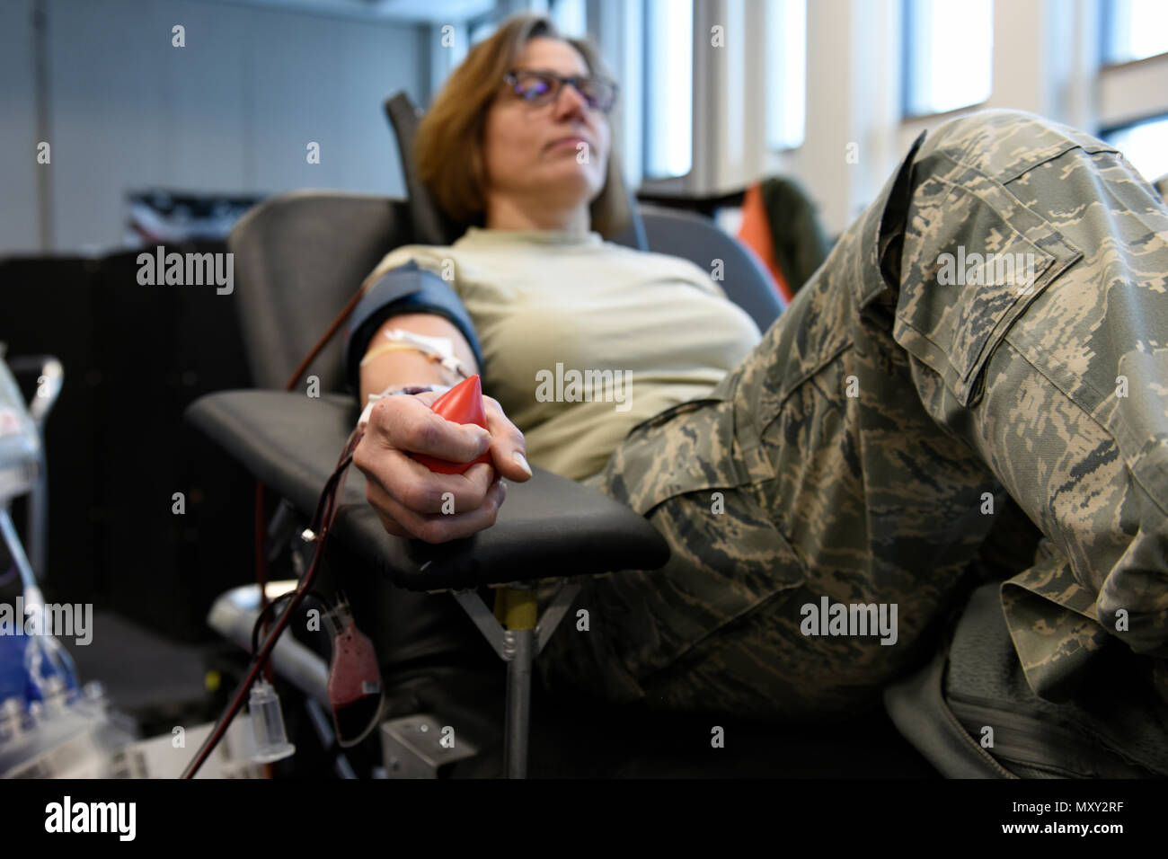 Master Sgt. Ann McCormick, the Management Internal Control Tool Self-Assessment Program Manager assigned to the 180th Fighter Wing, gives a double red cell donation at the American Red Cross blood drive in Swanton, Ohio Dec. 14, 2016. Donating blood is one of the ways our Airmen strive to give more to the community than given. Stock Photo