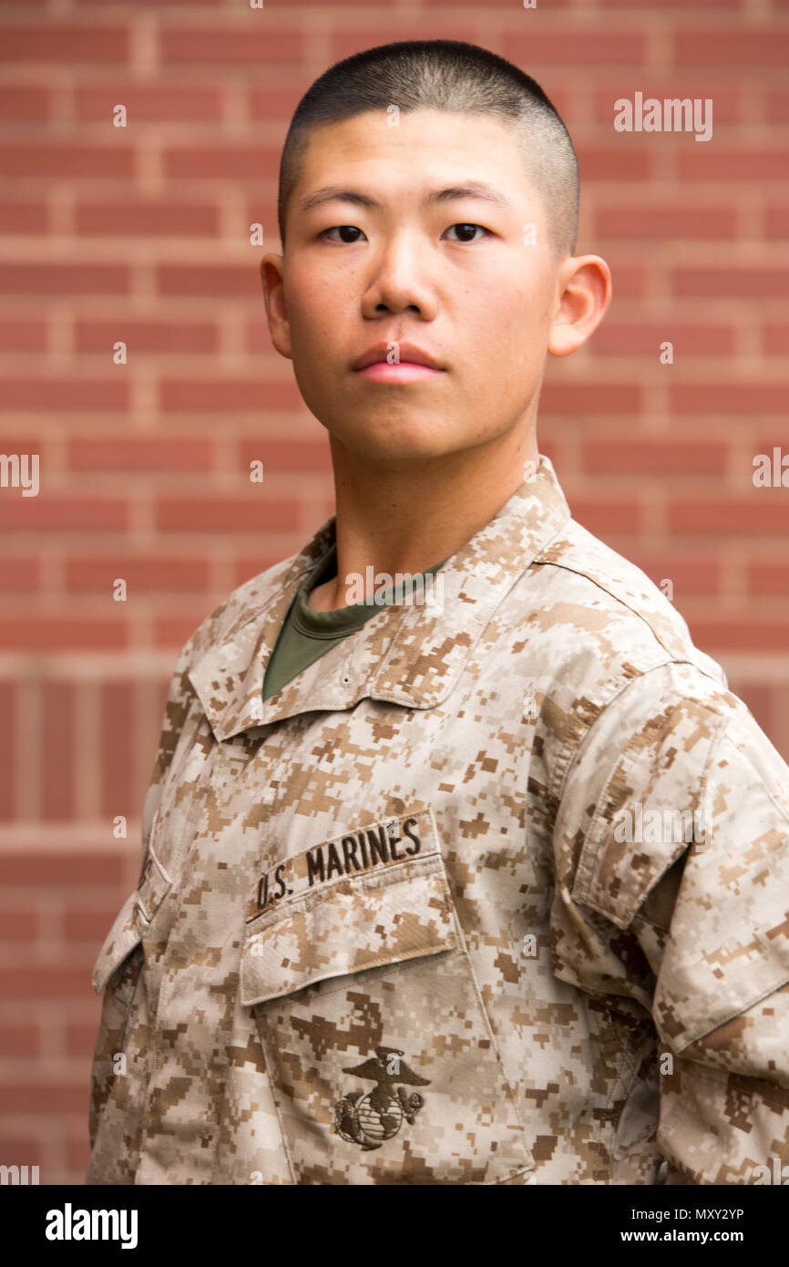 Pvt. Junjie Kuang, Platoon 1100, Bravo Company, 1st Recruit Training Battalion, earned U.S. citizenship Dec. 15, 2016, on Parris Island, S.C. Before earning citizenship, applicants must demonstrate knowledge of the English language and American government, show good moral character and take the Oath of Allegiance to the U.S. Constitution. Kuang, from Queens, N.Y., originally from China, is scheduled to graduate Dec. 16, 2016. (Photo by Lance Cpl. Maximiliano Bavastro) Stock Photo