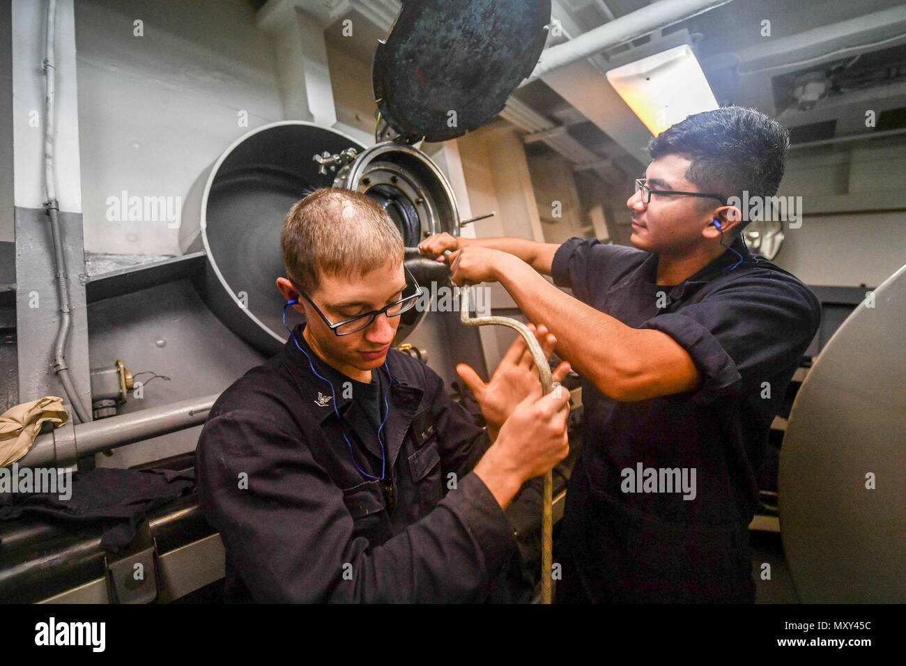 Sailors prepare to deploy the multi-function towed array (MFTA) sonar ...