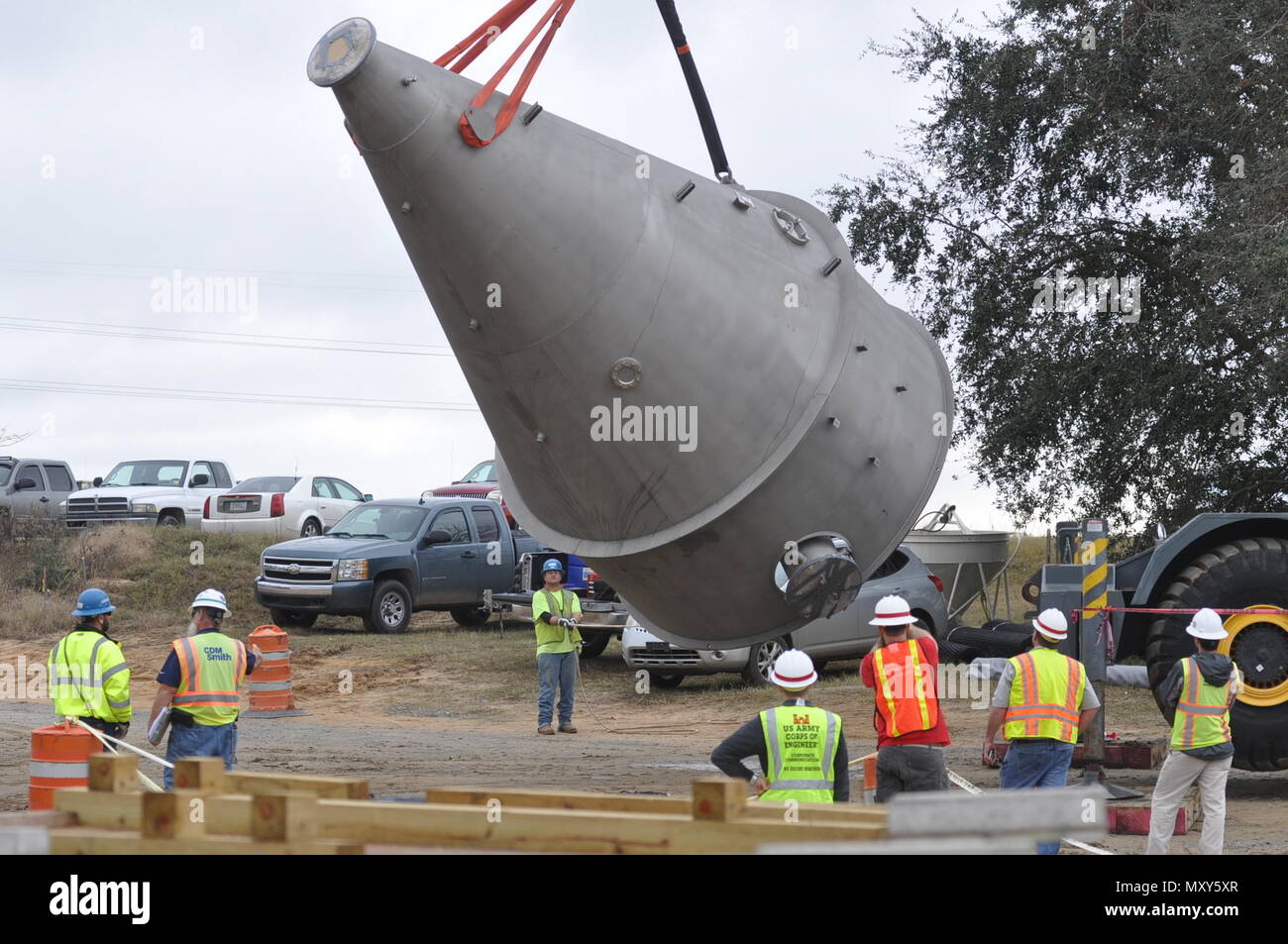 Workers unload four Speece cones delivered Dec. 14, 2016, to an Army Corps of Engineers site along the Savannah River. The Speece cones, each about 22 feet tall when installed, will dissolve pure oxygen into water extracted from the river, then push the water back into the river. The process will replace dissolved oxygen in the river lost as the Corps of Engineers deepens the harbor from its current 42-foot authorized depth to 47 feet.    The replacement of dissolved oxygen lost to the deepening of the Savannah River forms one of the environmental mitigation actions taken by the Corps for the  Stock Photo