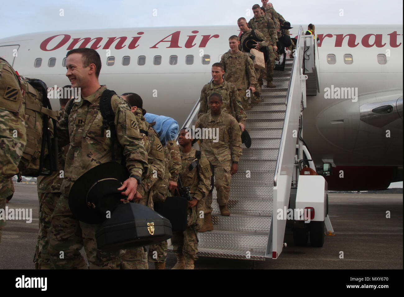 Soldiers of 6th Squadron, 8th Cavalry Regiment, 2nd Infantry Brigade Combat Team, 3rd Infantry Division, arrive at Hunter Army Airfield, Georgia, December 13, 2016. Troopers of 6-8 Cav. returned from a five-month rotation supporting Joint Multinational Training Group-¬Ukraine, building sustainable training capacity and capability within Ukrainian land forces. (U.S. Army photo by Sgt. Joshua Laidacker/Released) Stock Photo