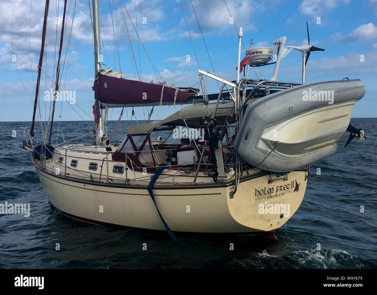 Coast Guard crew members from Station Fort Myers Beach rescue three