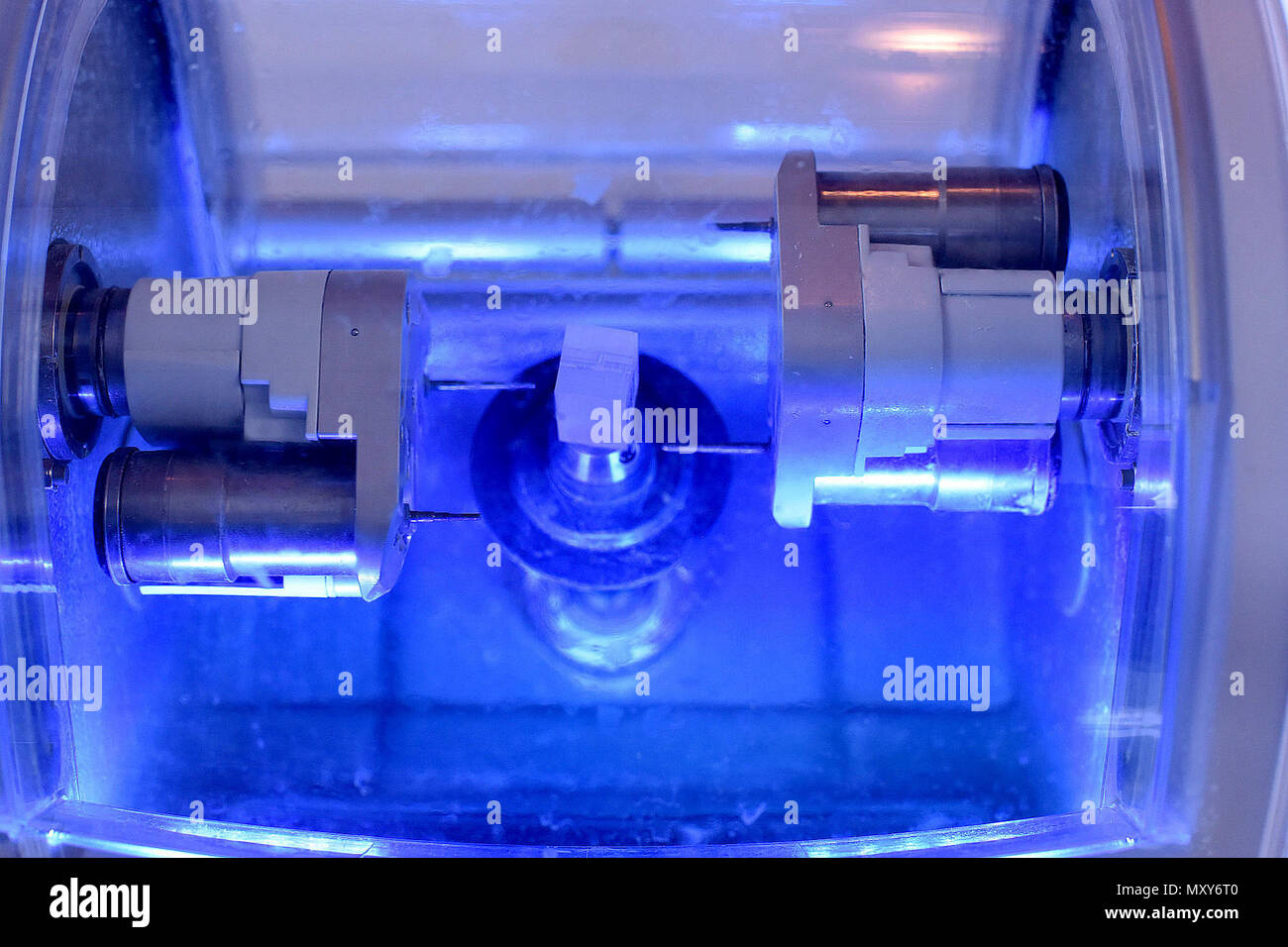 A milling machine mills a tooth for a crown in the dental