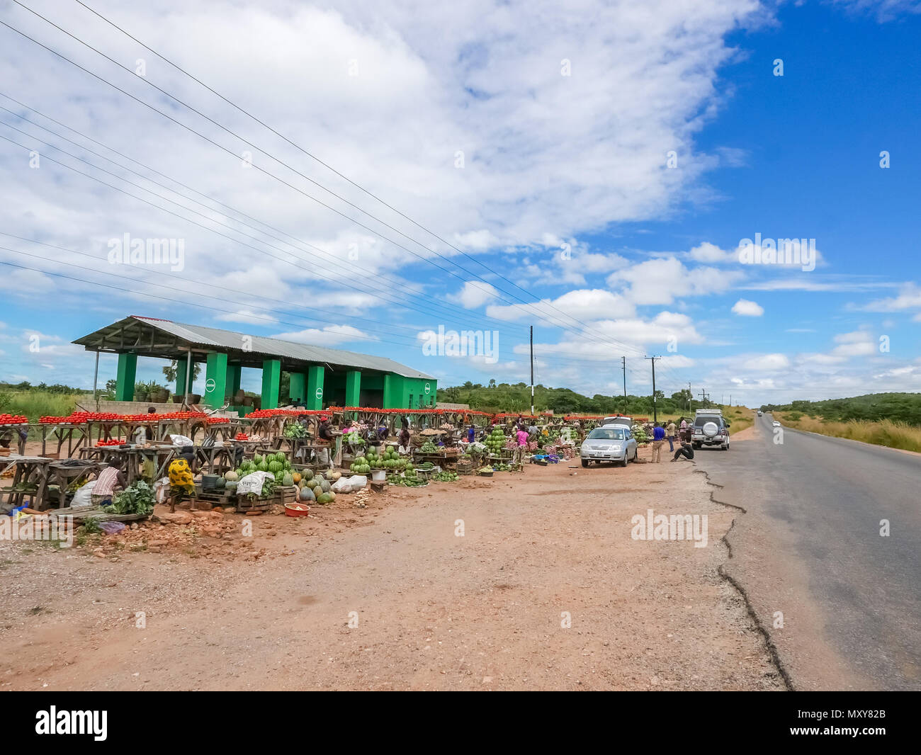 Lusaka, Zambia - April 3, 2015: People stopping at the local market place just at the road before Lusaka Stock Photo