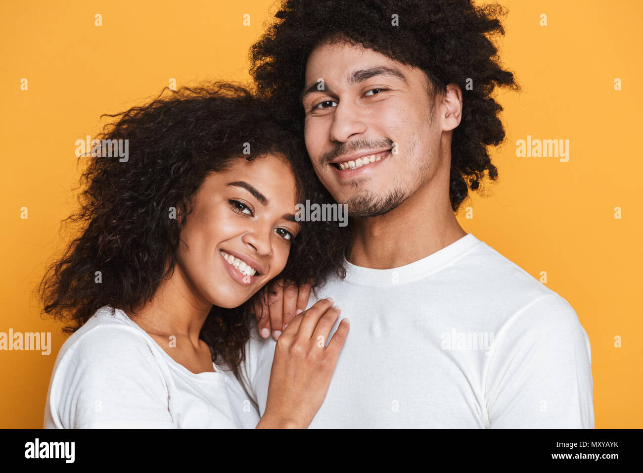Close up portrait of a lovely young afro american couple hugging ...