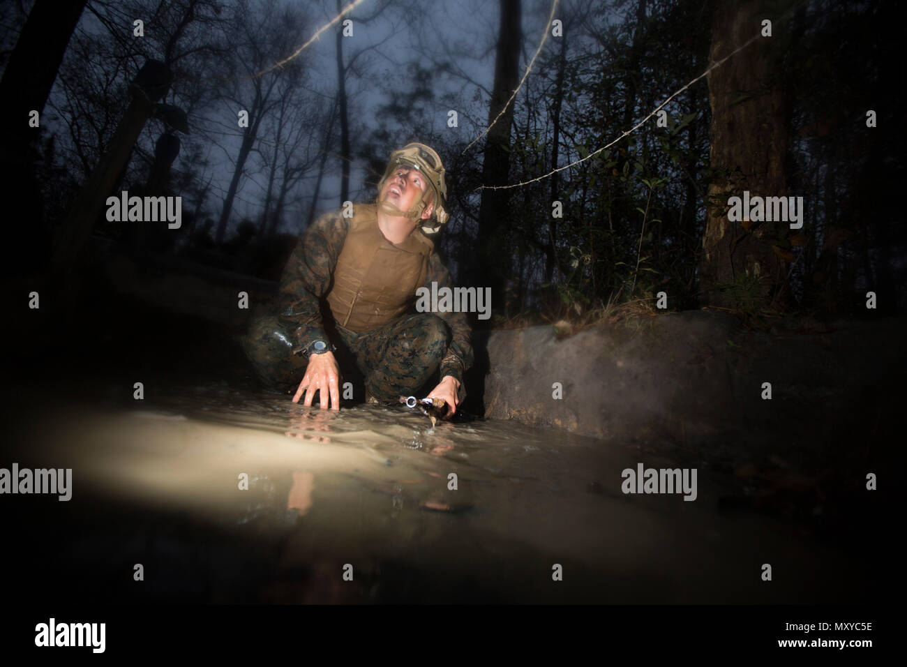 A U.S. Marine Corps combat videographer from the Combat Camera section ...