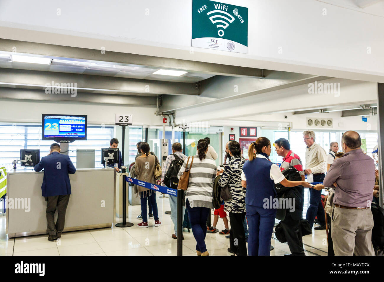 Mexico City,Mexican,Hispanic,Benito Juárez International Airport MEX,terminal gate,boarding gate,line queue,man men male,woman female women,free wifi Stock Photo