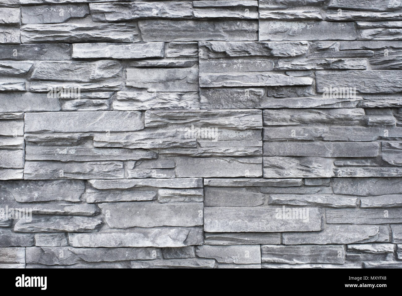 tiled natural stone wall background - granite stone texture Stock Photo