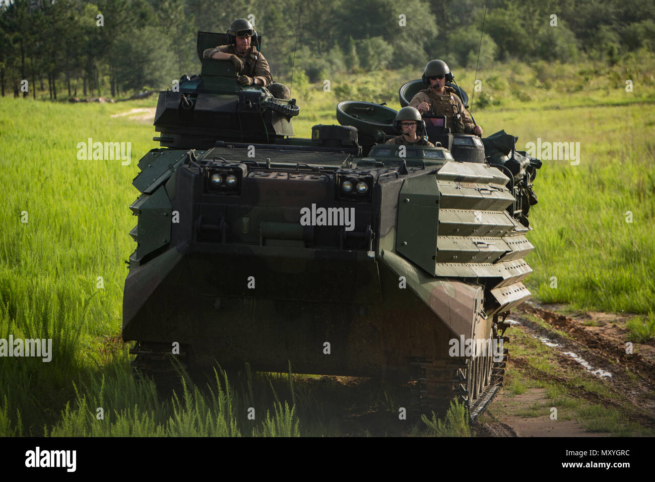 U.S. Marines with Mobility and Counter-Mobility Platoon, 2nd Assault Amphibian Battalion (AABn), 2nd Marine Division, drive an AAV-P7/A1 assault amphibious vehicle to a firing range during a deployment for training (DFT) exercise at Fort Stewart, Ga., May 29, 2018. The unit executed numerous ranges as part of the DFT to enhance their combat readiness and efficiency with the AAV-P7/A1. The DFT assists in maintaining proficiency in landing the surface assault element during amphibious operations to inland objectives with conduction mechanized operations and related combat support in operations a Stock Photo
