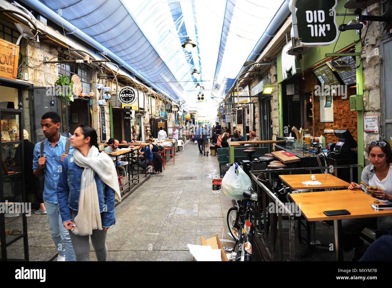 Bars and restaurants dominate the Machane Yehuda market. Stock Photo