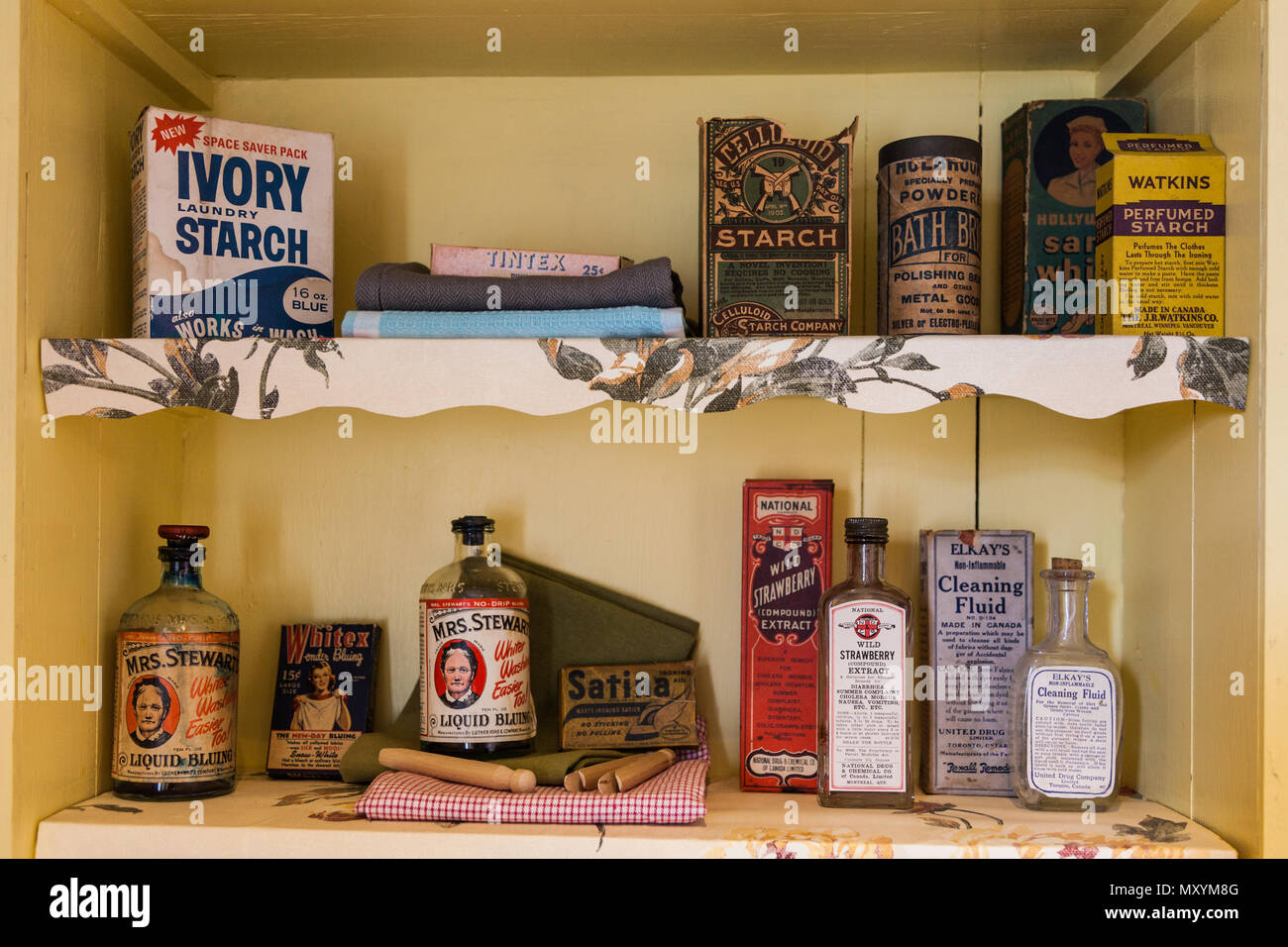 Older laundry room products on a shelf in a heritage display house in