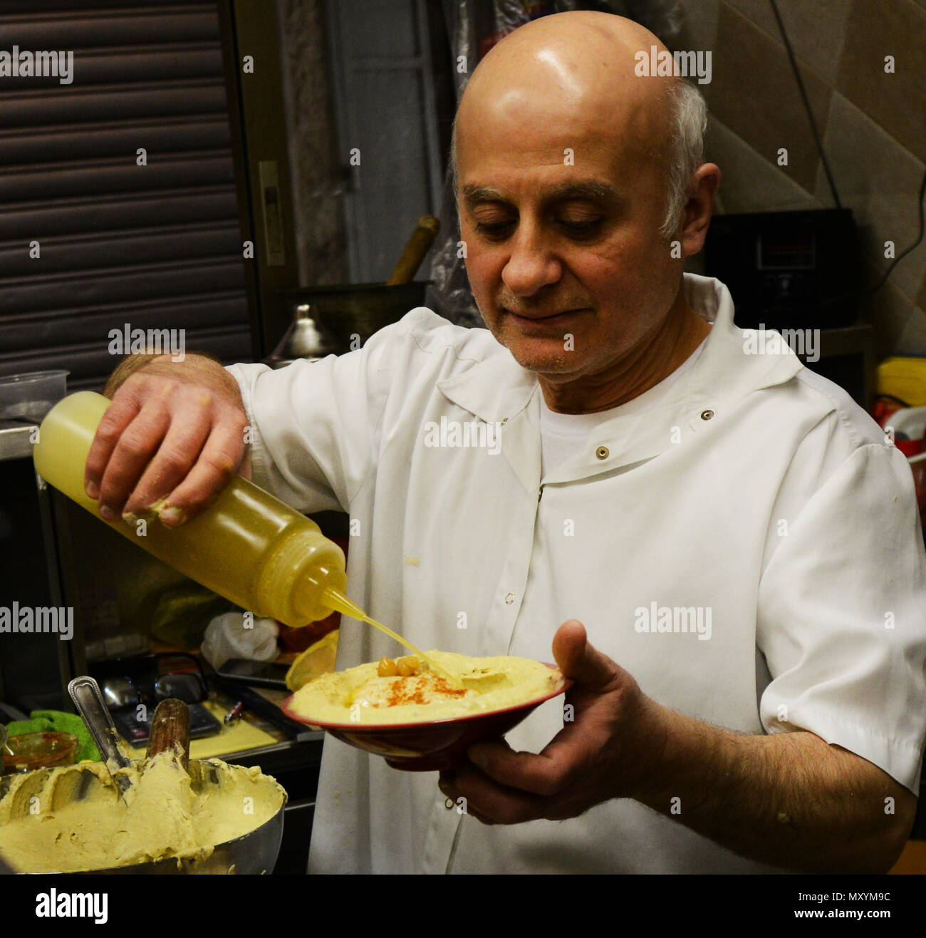 Ziyad Abu Shukri preparing his famous Hummus Stock Photo - Alamy