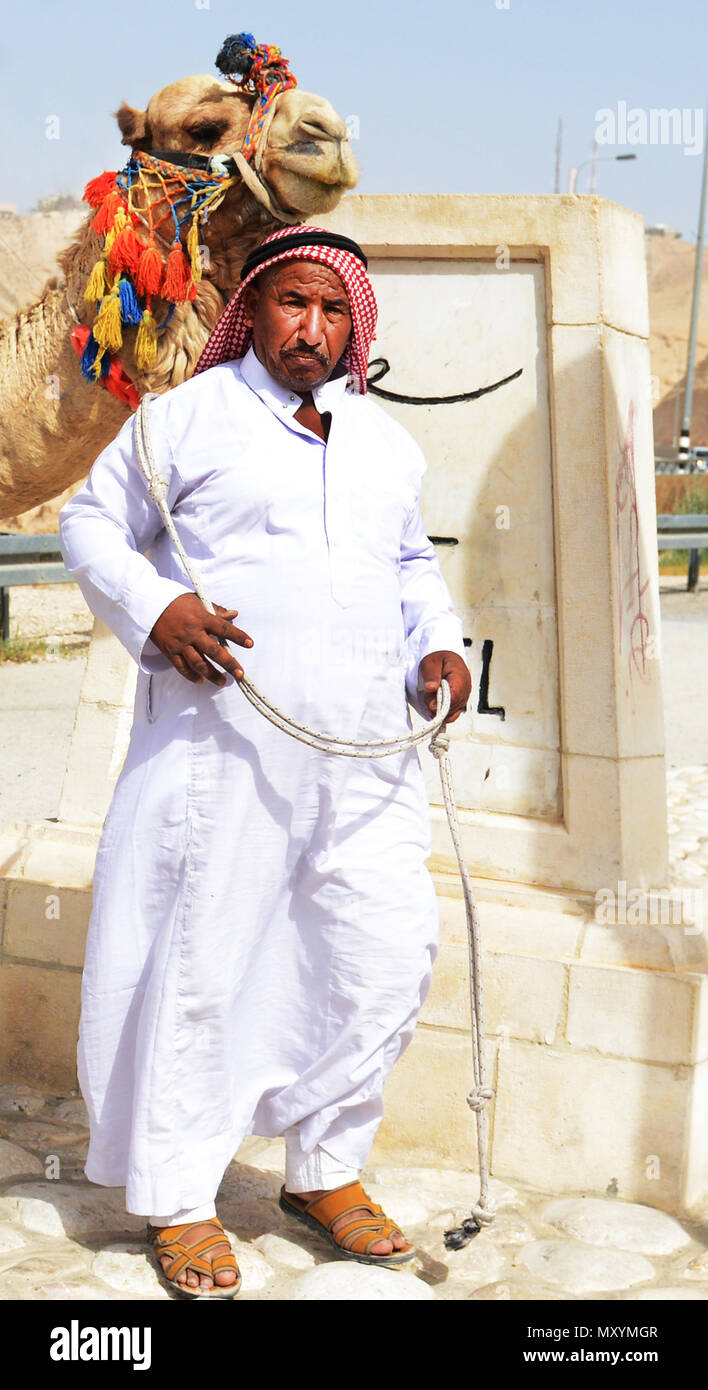 A traditionally dressed Bedouin man in the Judaean desert in Israel. Stock Photo
