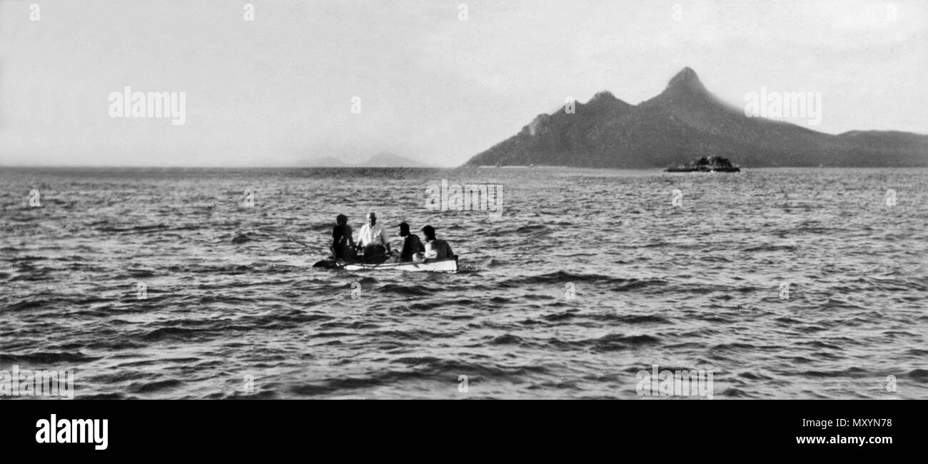 Messrs Davidson and Deering bringing aboard a captured Turtle, Lion. Queensland's Commissioner of Railways Mr. J. W. Davidson and Sydney businessman Hastings Deering on a private fishing trip. Stock Photo