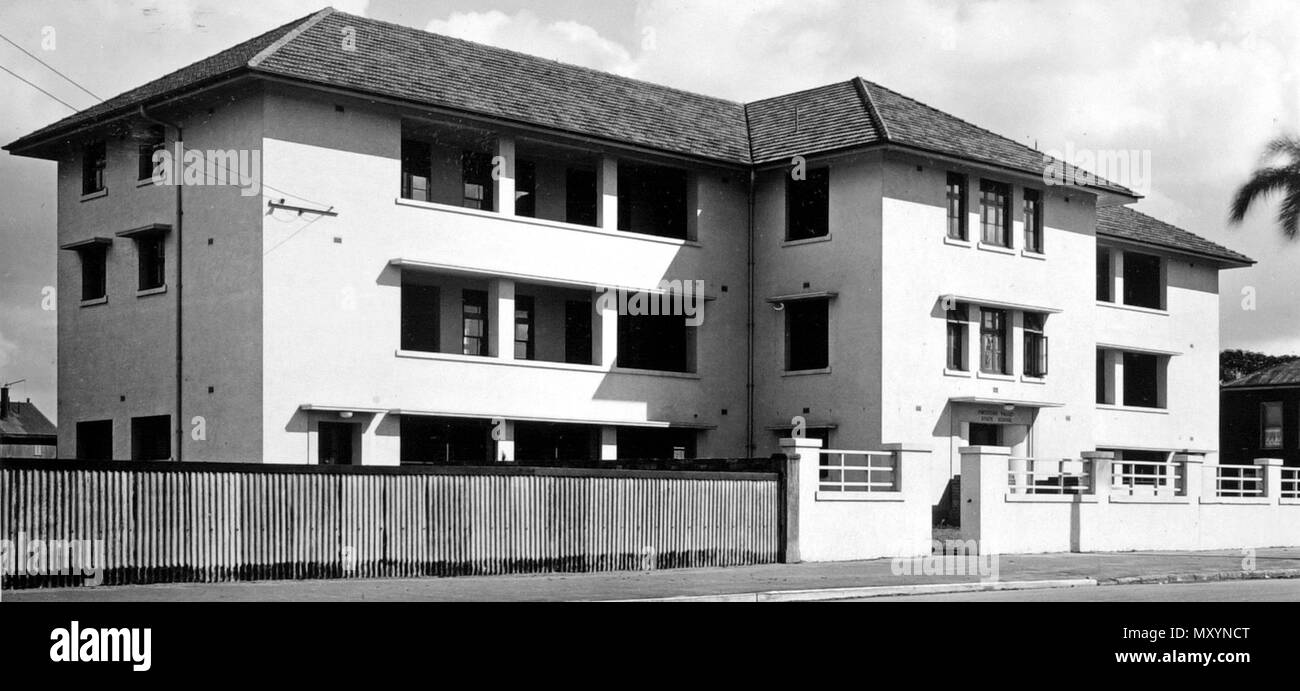 New School, Fortitude Valley, July 1950. Sunday Mail 29 January 1950  £30,961 IMPROVEMENT IN SCHOOL 98296307 )   THE first school built in the Valley cost £39/14/3. The new one opened by the Education Minister (Mr. Bruce) in Brookes Street, Valley, yesterday afternoon cost £31,000.  The new building contains six large, well equipped, and well-ventilated classrooms, and will accommodate 250 pupils. Built of brick, with plaster facings, the school embraces the latest in modern designs to ensure first-class conditions for pupils and teachers.  There are ample amenities for physical training and r Stock Photo