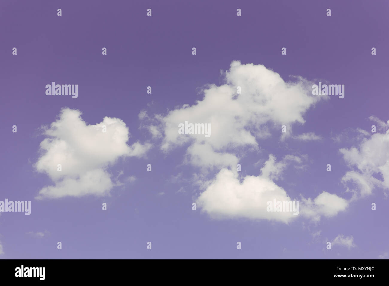 Purple sky with group of white clouds as wallpaper or background Stock  Photo - Alamy