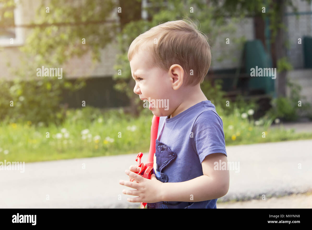 the child cries of resentment, sobs sobbingly covering his face with ...
