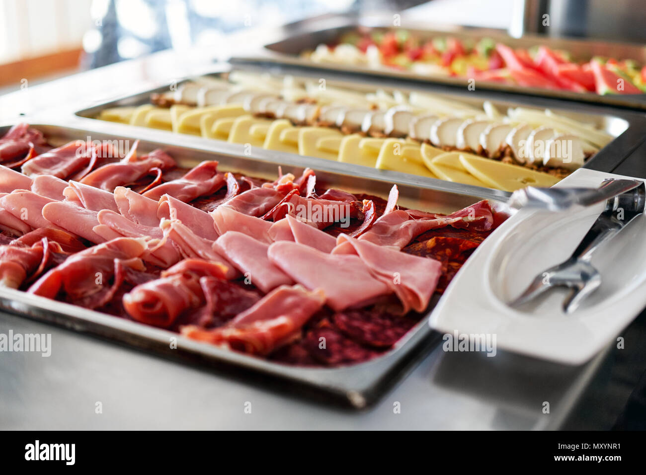 Buffet trays with a various delicious appetizers close-up. Breakfast in hotel. Smorgasbord. Stock Photo