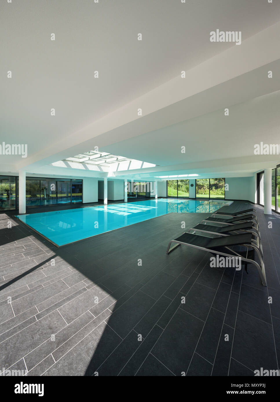indoor swimming pool of a modern house with spa Stock Photo
