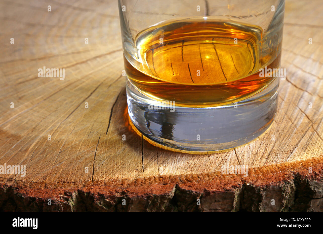 whisky on a tree stump Stock Photo Alamy