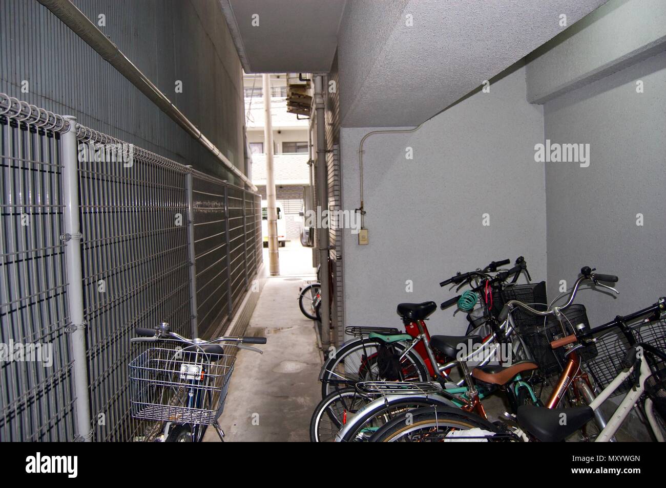 Crowded bicycle parking lot in a residential area of downtown Osaka