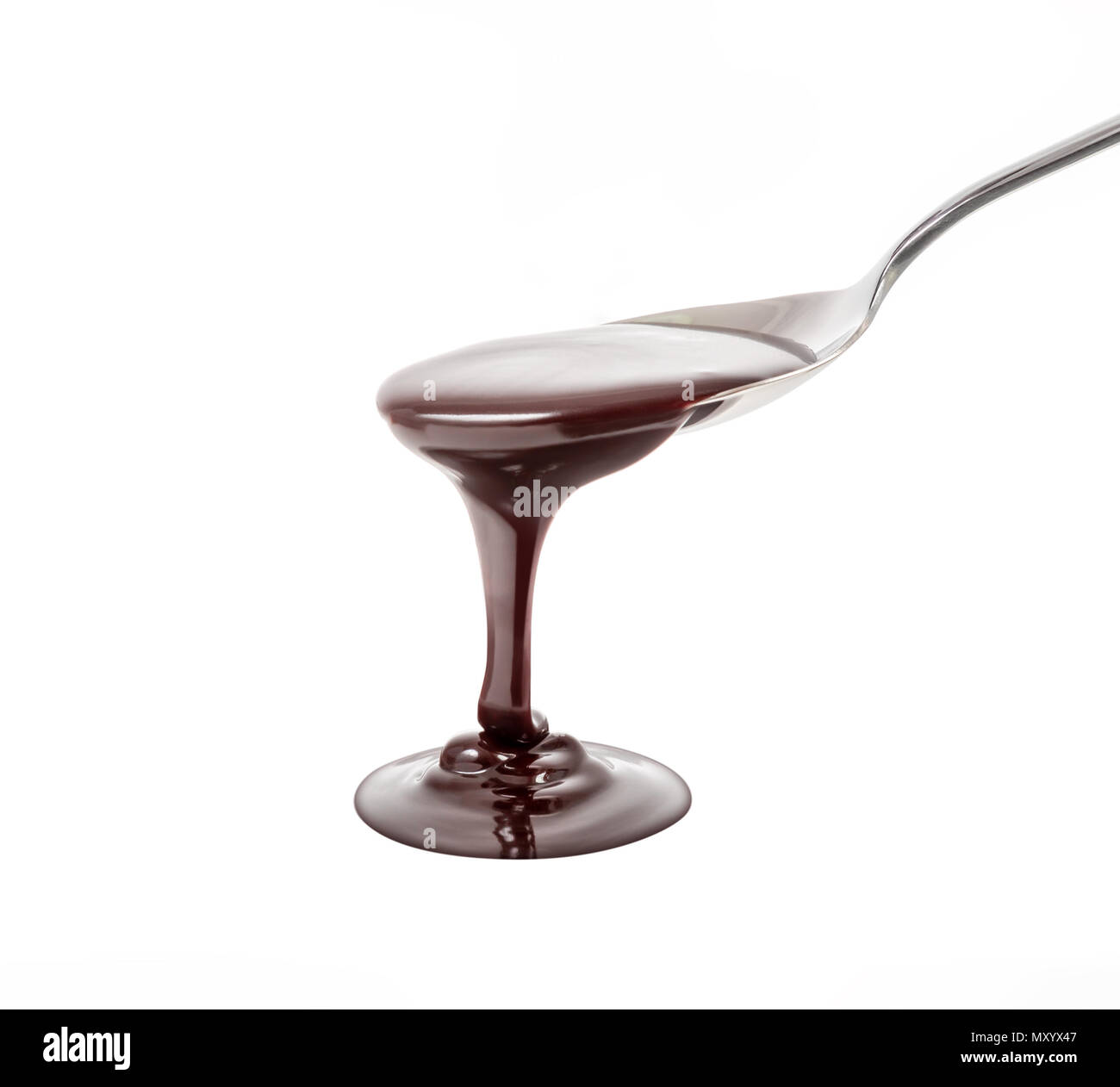 chocolate syrup pouring on spoon, cooking, baking Stock Photo Alamy