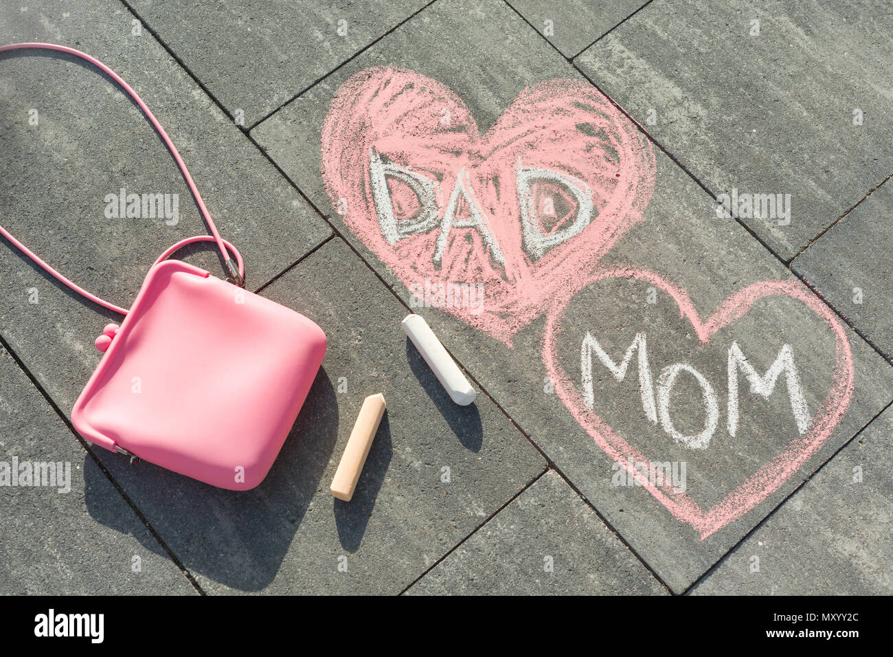 Children's drawing on asphalt text - Mom and Dad in heart Stock Photo ...