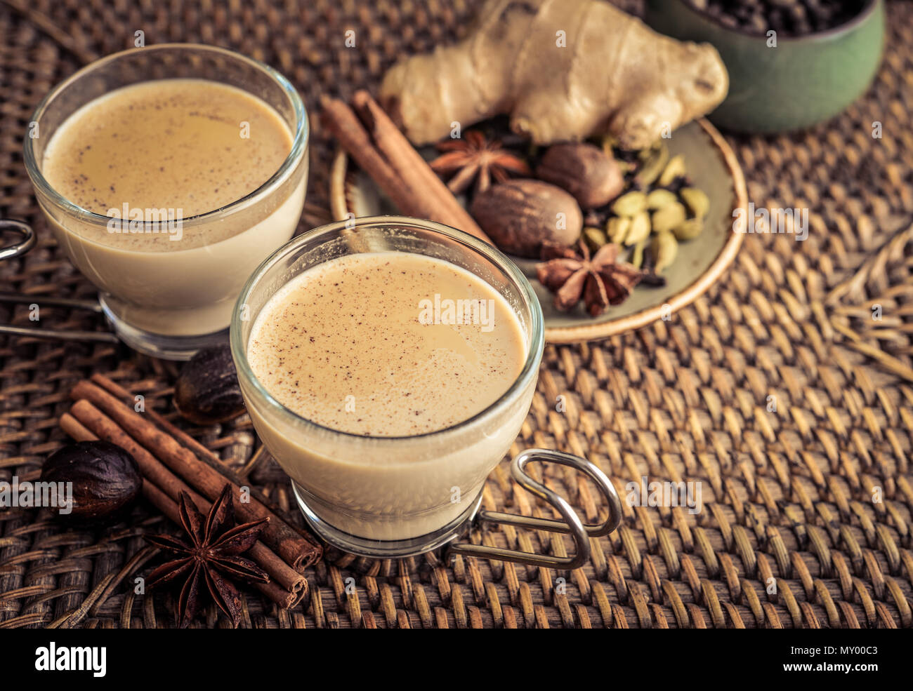 Traditional indian drink masala chai tea (milk tea) with spices on