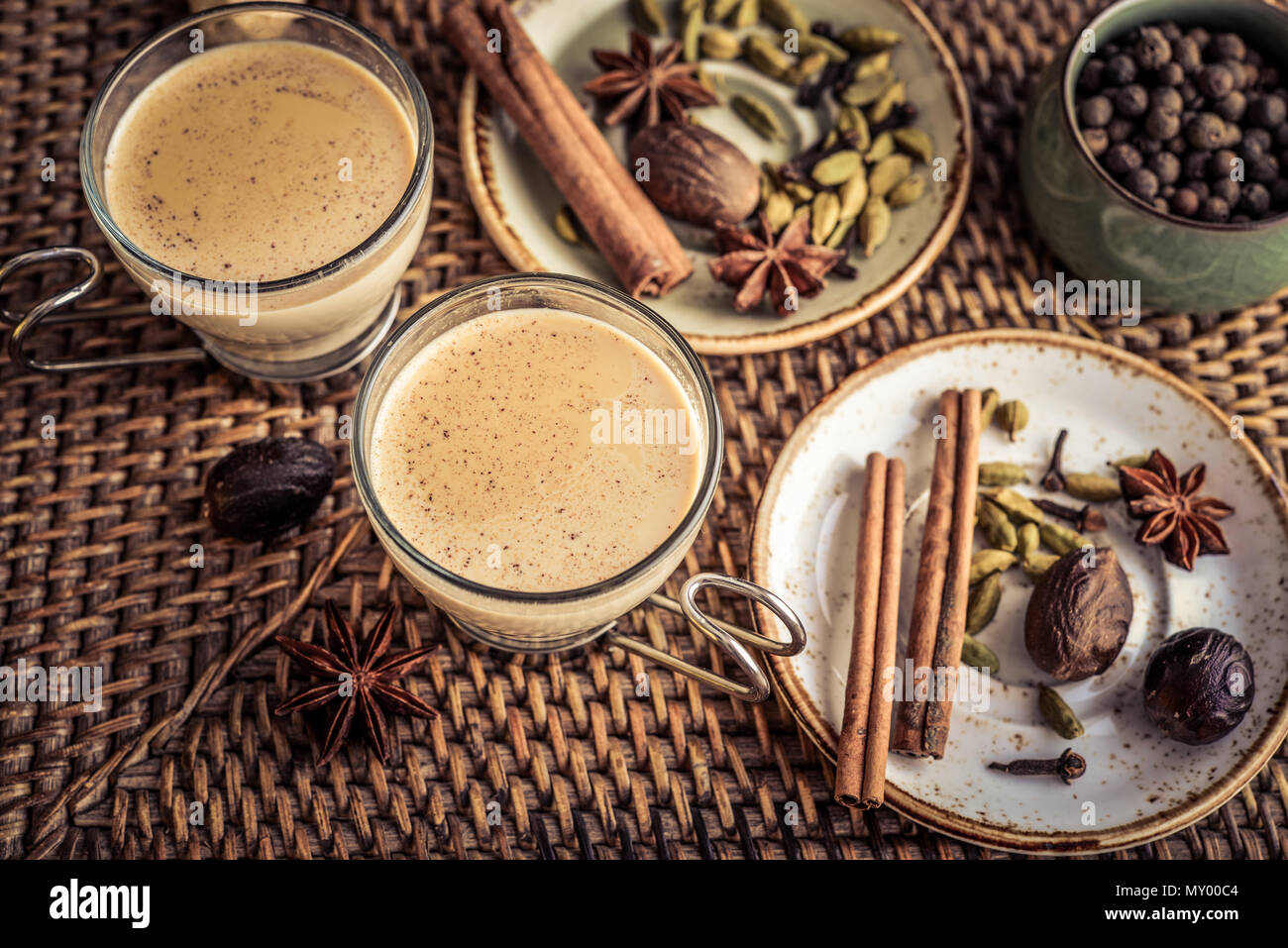 Traditional indian drink masala chai tea (milk tea) with spices on