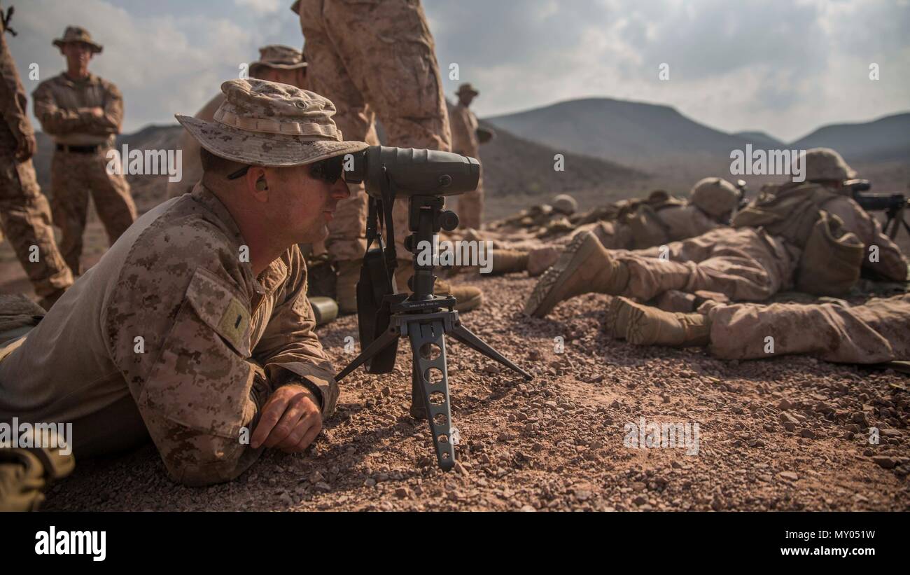 U.S. Marine 1st Lt. Austin May, a platoon commander with Company C, Battalion Landing Team 1st Bn., 4th Marines, 11th Marine Expeditionary Unit (MEU), observes and assesses individual Marines’ performance during an unknown distance Range during Exercise Alligator Dagger at Arta Beach, Djibouti, Dec. 13, 2016. During the exercise, Marines with BLT 1/4 will work to refine and rehearse their ability to conduct amphibious and land-based skills to include: helo-borne raids, amphibious assaults, combat marksmanship, and other rudimentary tactical skills. The unilateral exercise provides an opportuni Stock Photo