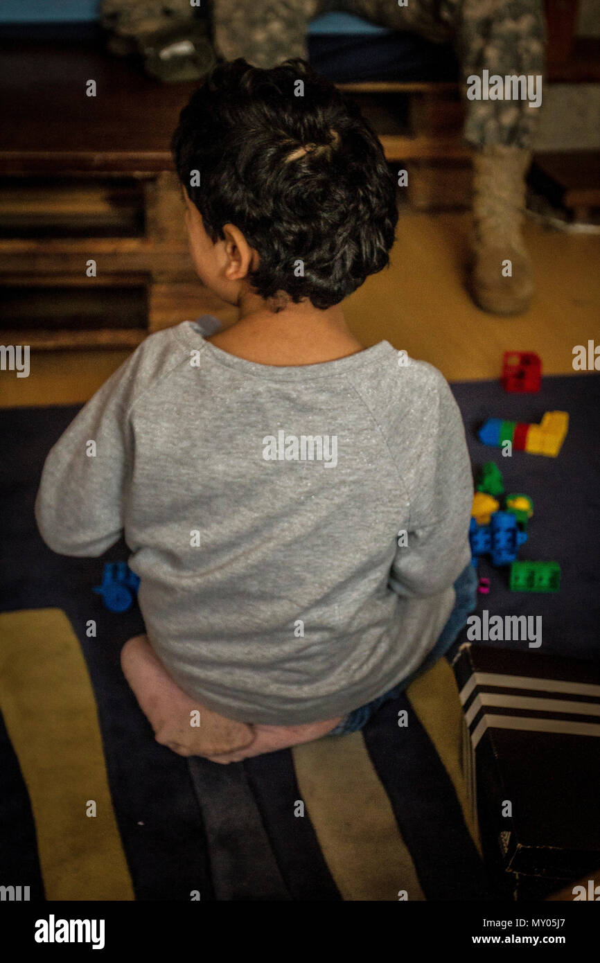 A child living at a shelter in Pristina, Kosovo, plays with a toy Dec