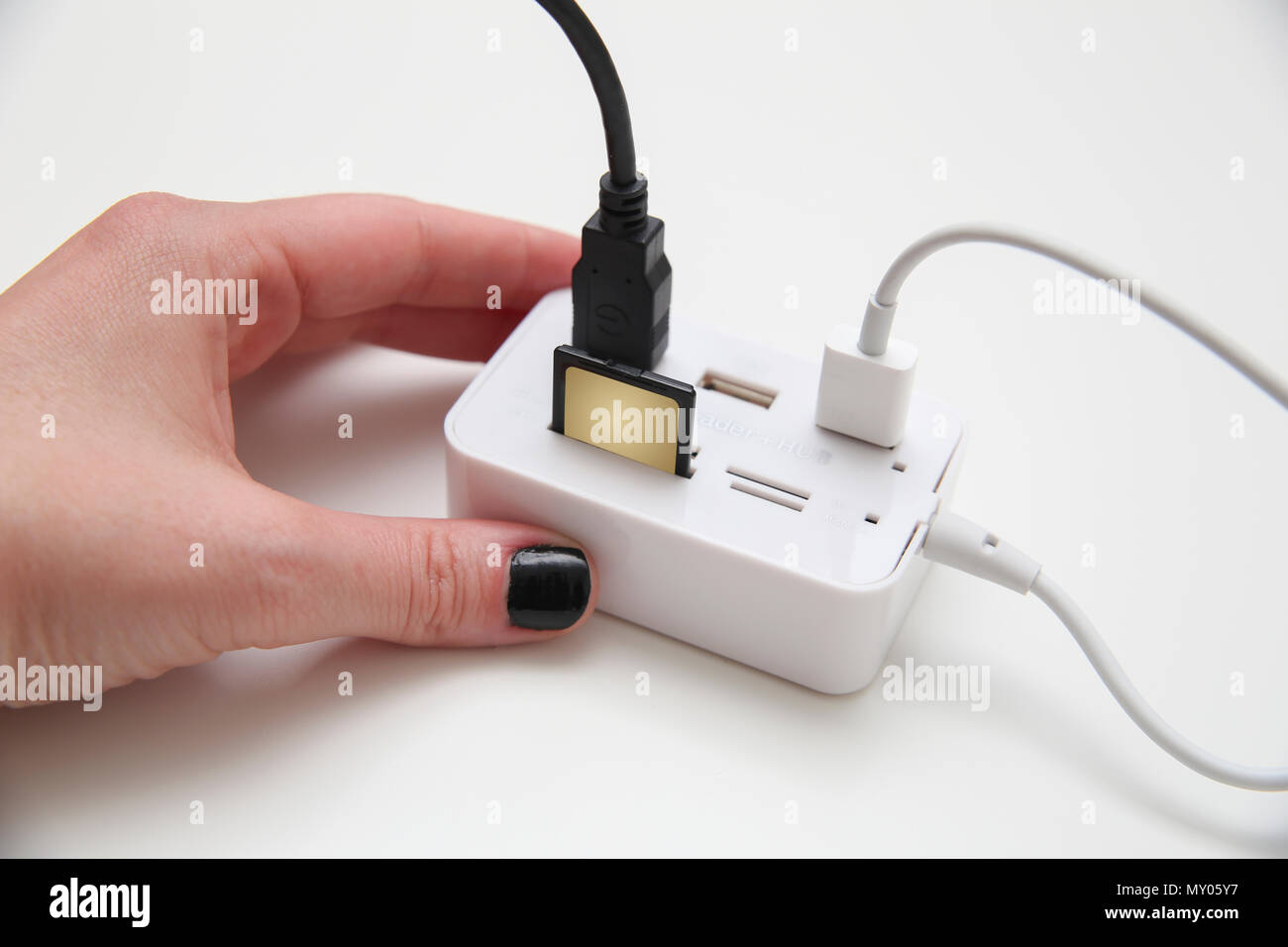 A USB flash drive into the card reader Stock Photo